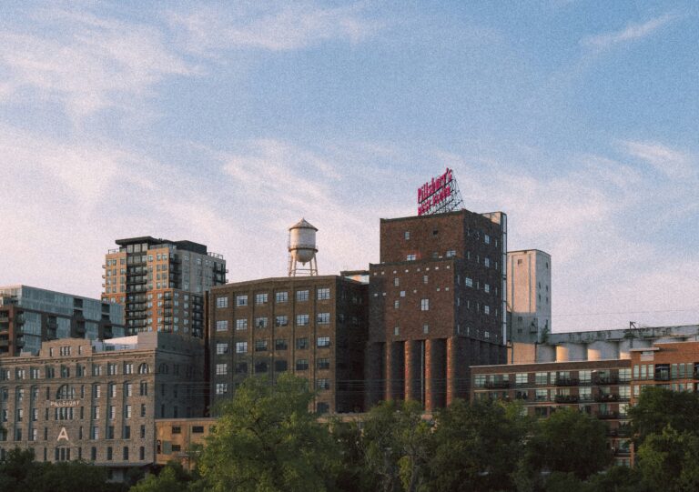 Minneapolis skyline at sunset with city buildings and a water tower