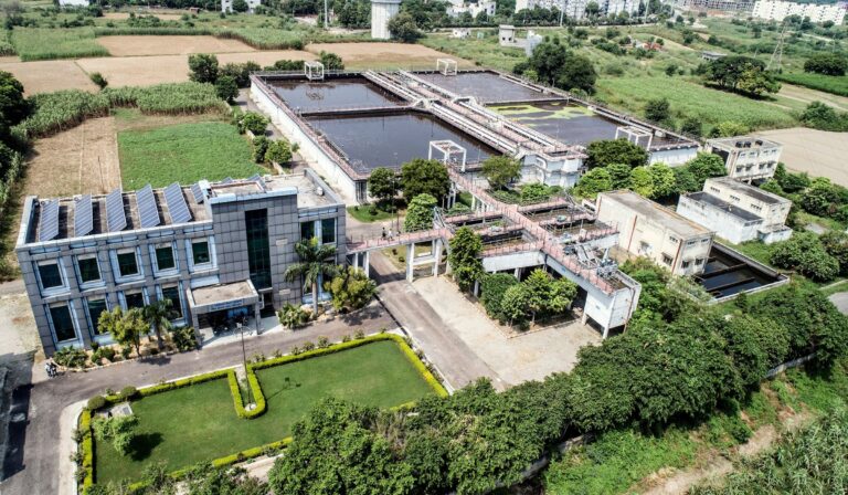 Aerial view of a water treatment plant and surrounding infrastructure