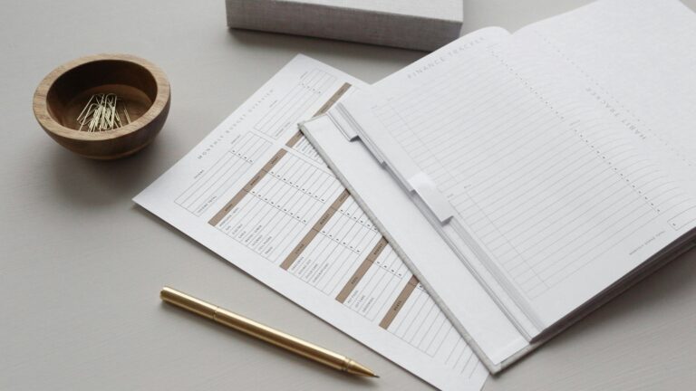 Stack of white printer paper on a desk, illustrating documentation for data reuse assessments