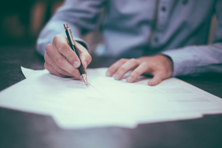 A desk with documents and a pen representing subject access request case management